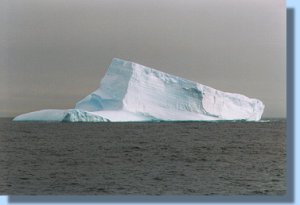 A large iceberg floating by
