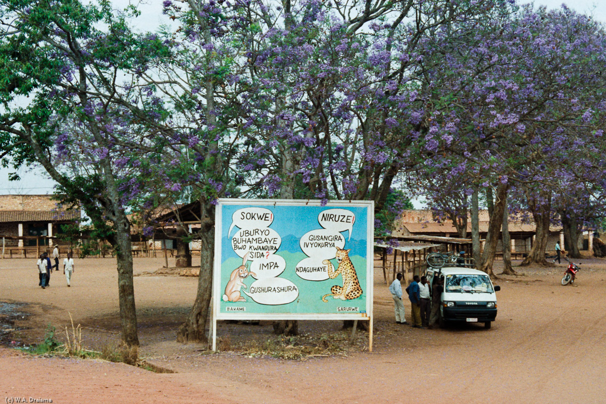 In 1992 aids is still spreading quickly and a sign warns about it in a small town.