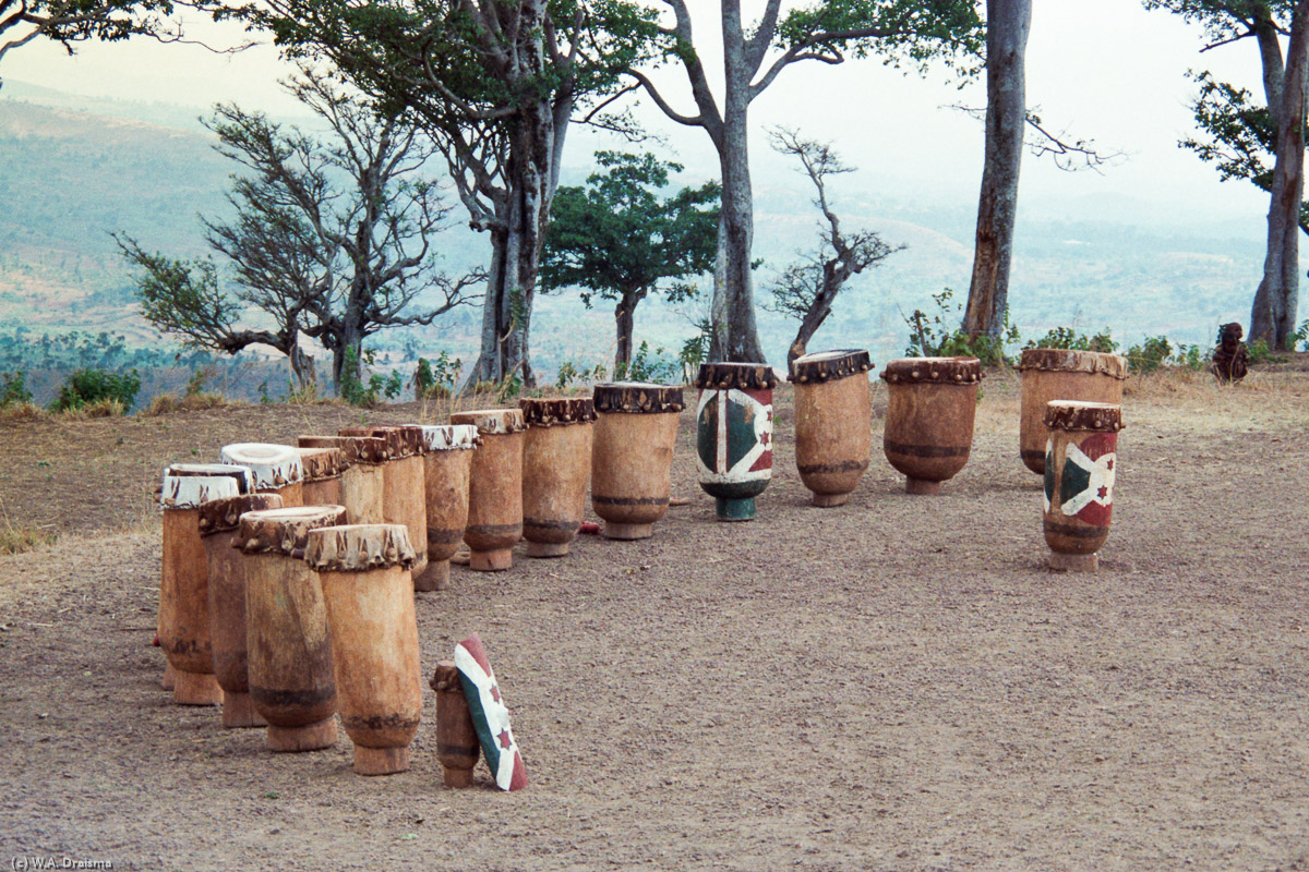 In a spot outside the village a semicircle of drums greets us. One after another men appear from the fields to prepare for a show.