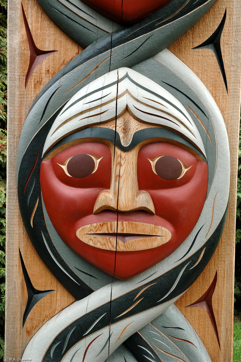 The Coast Salish people never made totem poles but they did make welcome arches as part of the entrance to their traditional longhouses. This new arch, one of three called People Amongst the People, shows three grandparents.