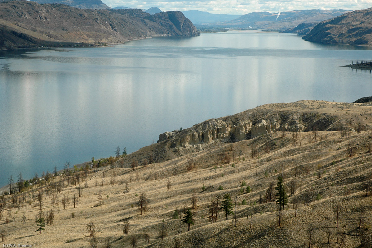 Kamloops Lake seen from a lookout next to the Trans-Canada Highway. Because most of the rain falls at the Cascade Mountains closer to the coast, the landscape is arid and the summers can be hot.