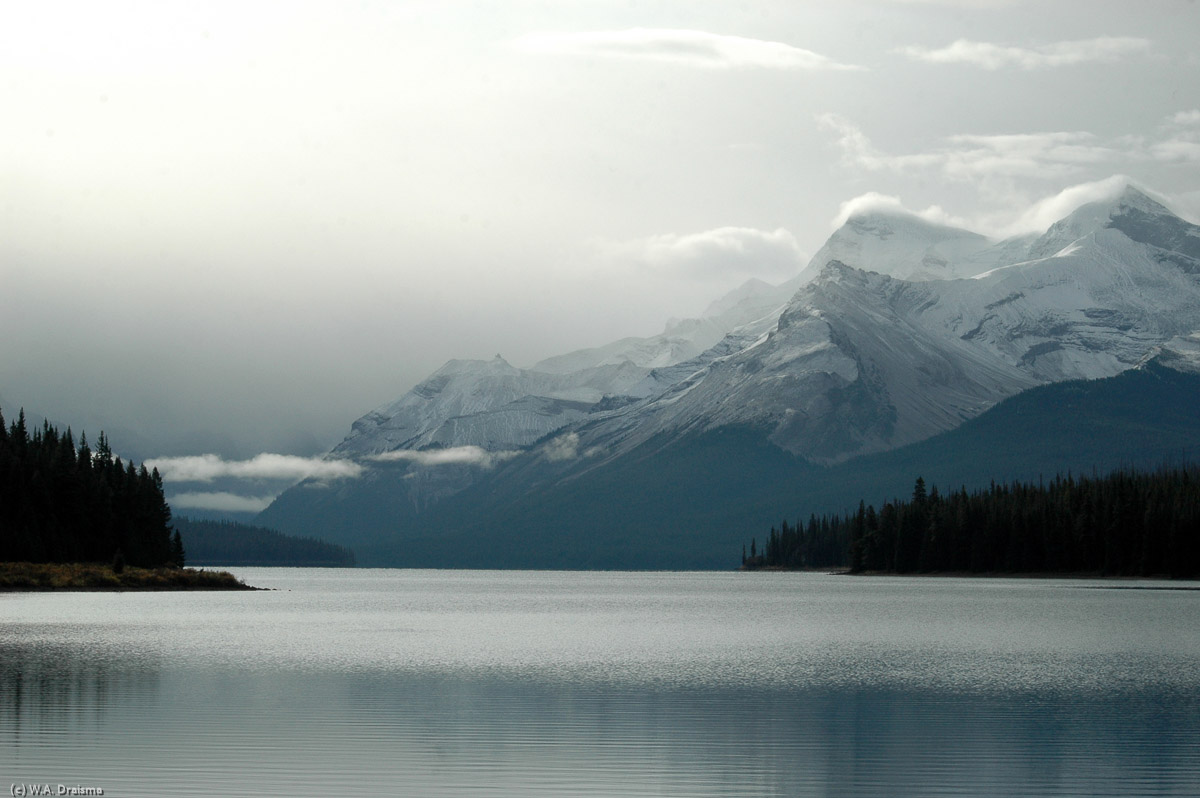 The tranquil surface of Maligne Lake guarded by Mounts Charlton (left) and Unwin (right).