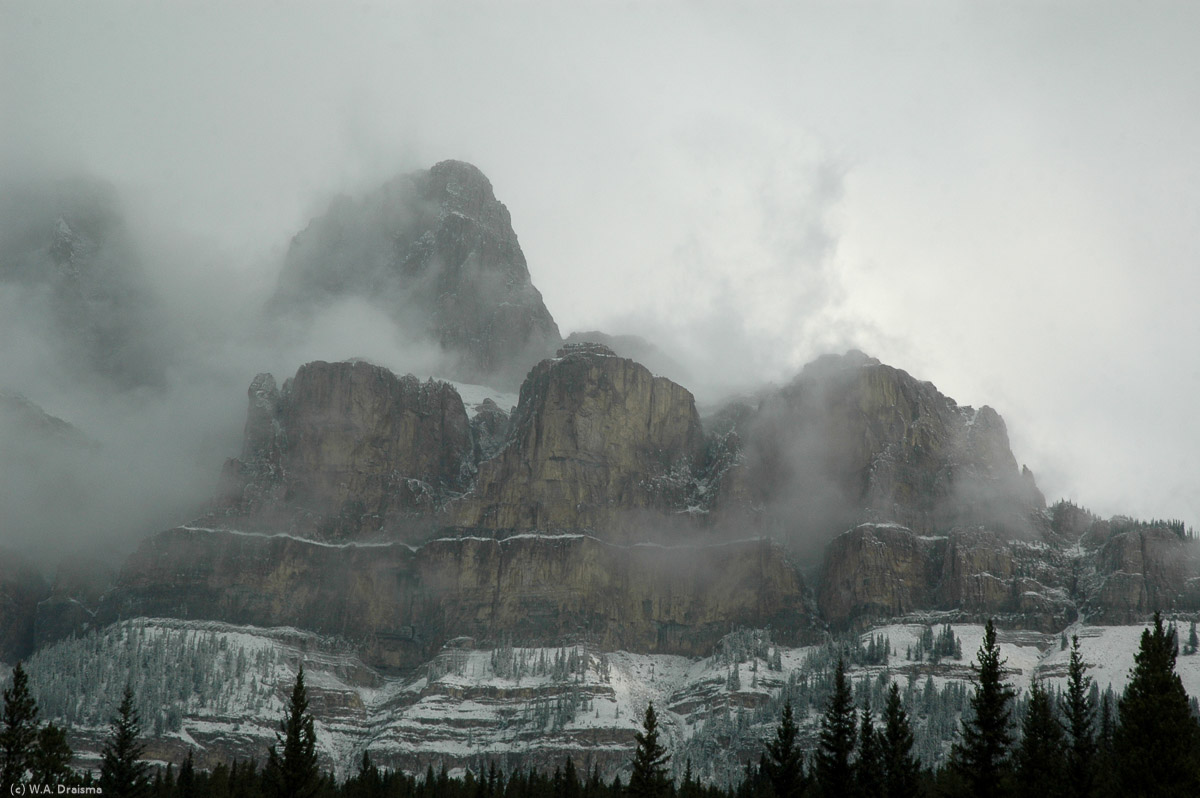 Castle Mountain, halfway between Lake Louise and Banff, shrouded in clouds. Named by James Hector in 1858 it stretches along a ridge for nearly 16km.