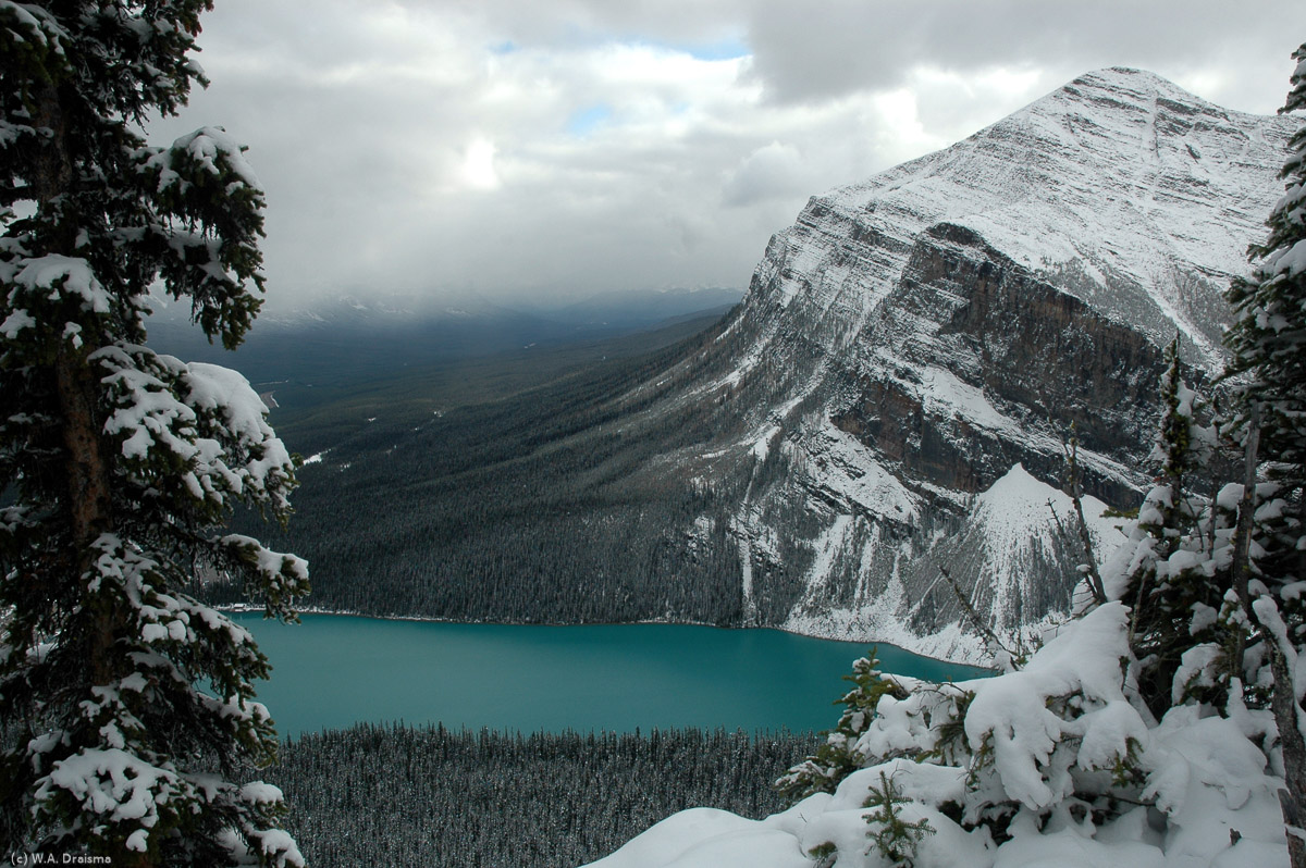 Mount Fairview overlooking the blue glacial lake of Lake Louise. The blue colour is the result of very fine-grained particles caused by glacial grinding floating in the water.