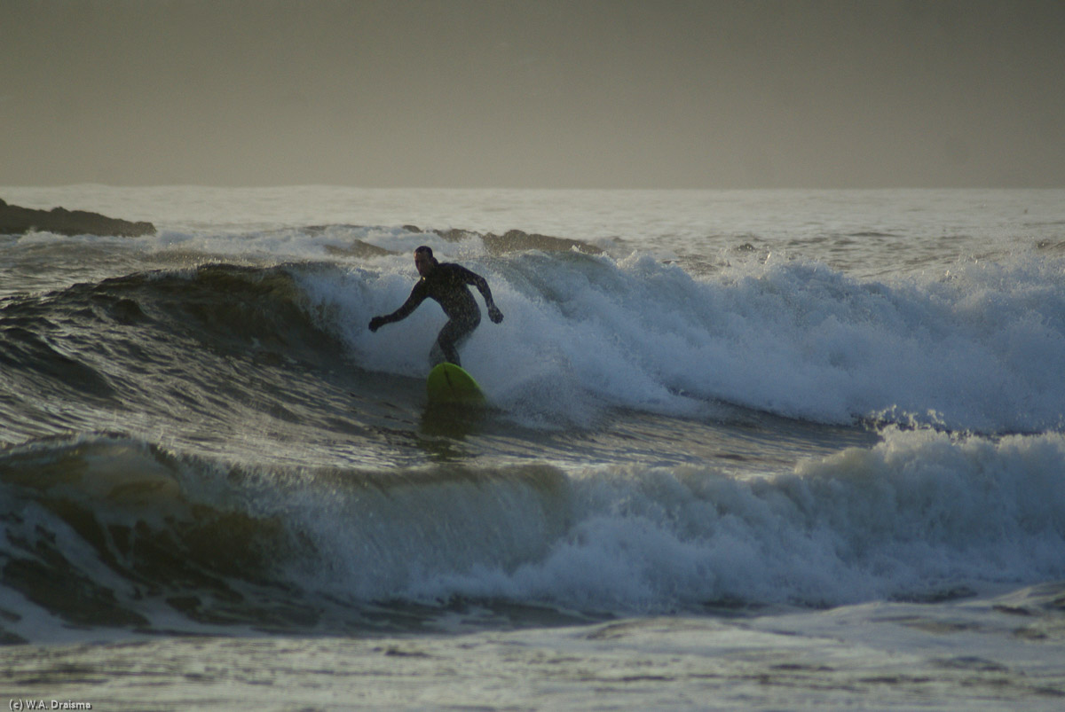 A surfer challenges the untamed waves at Long Beach Unit.