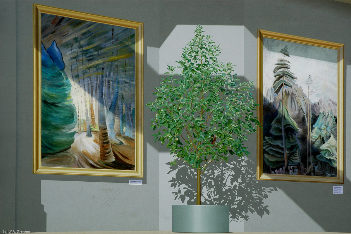 Detail of Steffan Jünemann's trompe l'oeil mural named "Emily's Beloved Trees" showing two of Emily Carr's paintings "Sombreness Sunlit" (left) and "Mountain Forest" (right).