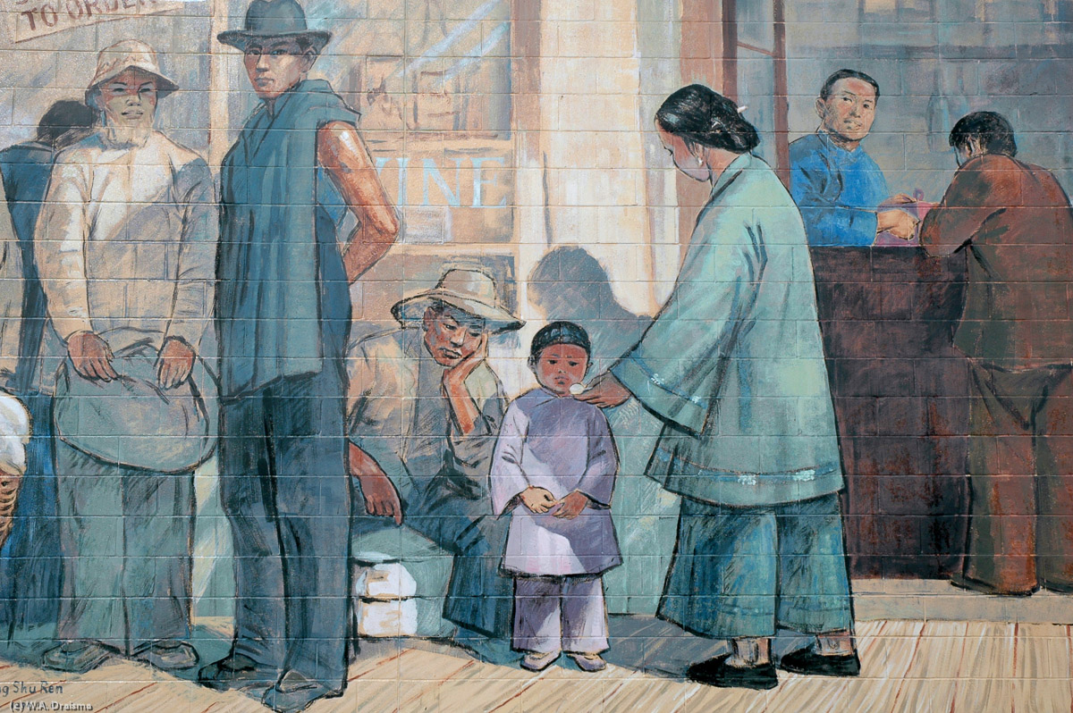 Detail of "Memories of a Chinese Boy", honouring the town's Chinese heritage. Grandma Chang gives candy to children while travellers wait for transport by sea at Sam Yee's store.
