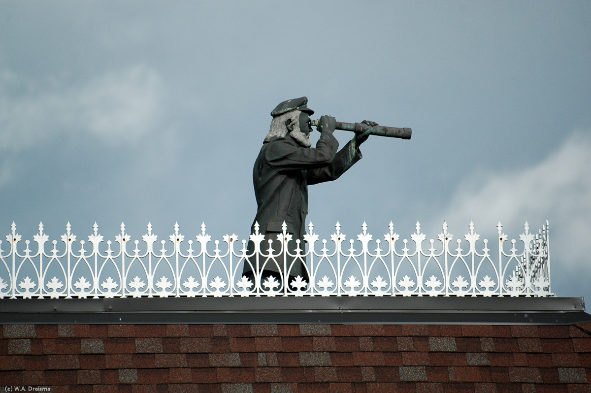 "Sea Captain" is a sculpture by Glen Spicer on the roof of a building on Willow Street.