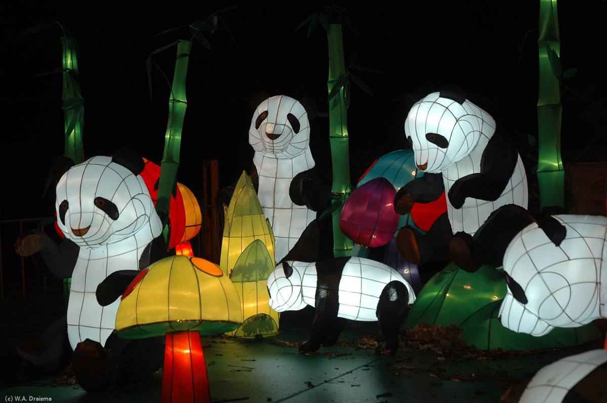 The next group of sculptures is on our right: a group of playful panda bears.