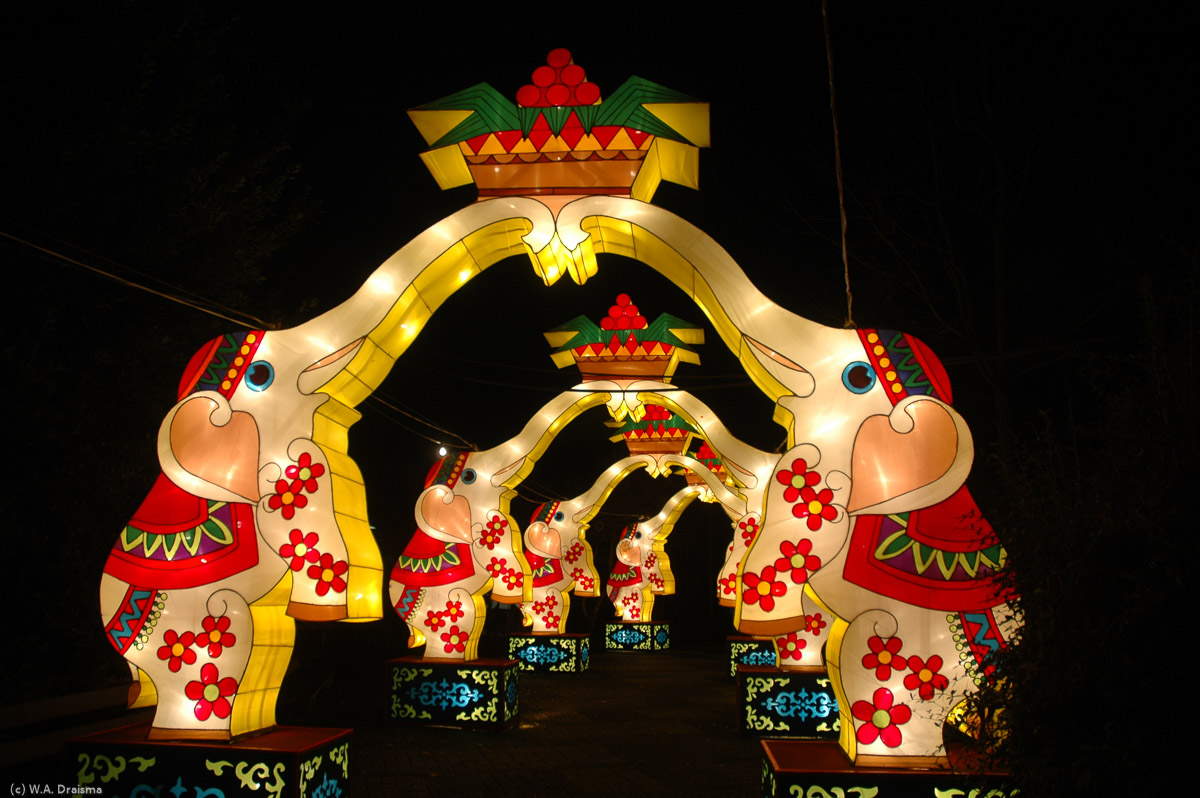 Turning to the left we cross another gate, this time with illuminated elephants.