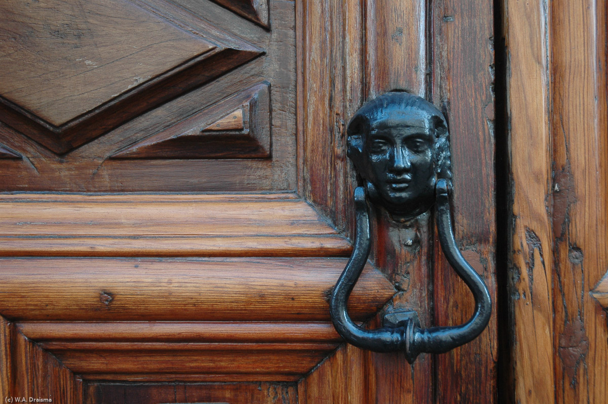 Detail of the wooden door of the Casa Montañéz with its door knocker. Dating from 1746 it has recently been restored.