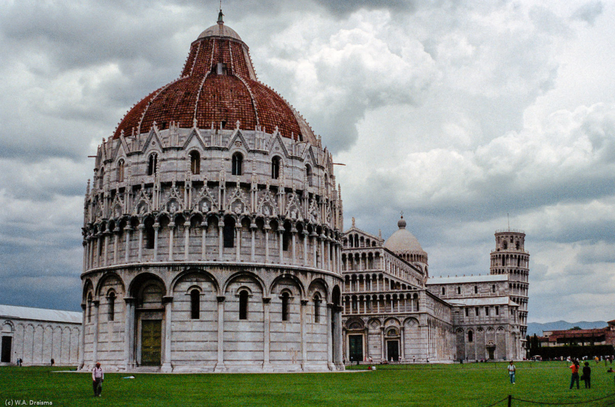 The Piazza del Duomo, or Piazza dei Miracoli as it is also known, is situated in the centre of Pisa. On the west end lies the Baptistery, a round Romanesque building dedicated to St. John the Baptist. Its construction began in the mid 12th century.