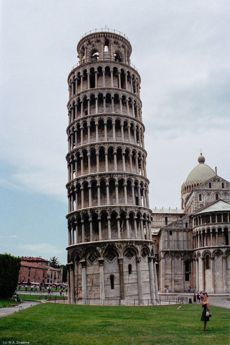 The Campanile, or Leaning Tower of Pisa as it is commonly known, lies on the est side. Construction of the bell tower began in 1173 and took place in three stages over the course of 177 years. Five years after construction it began sinking on its south side. At its greatest the lean measured approximately 5.5 degrees.