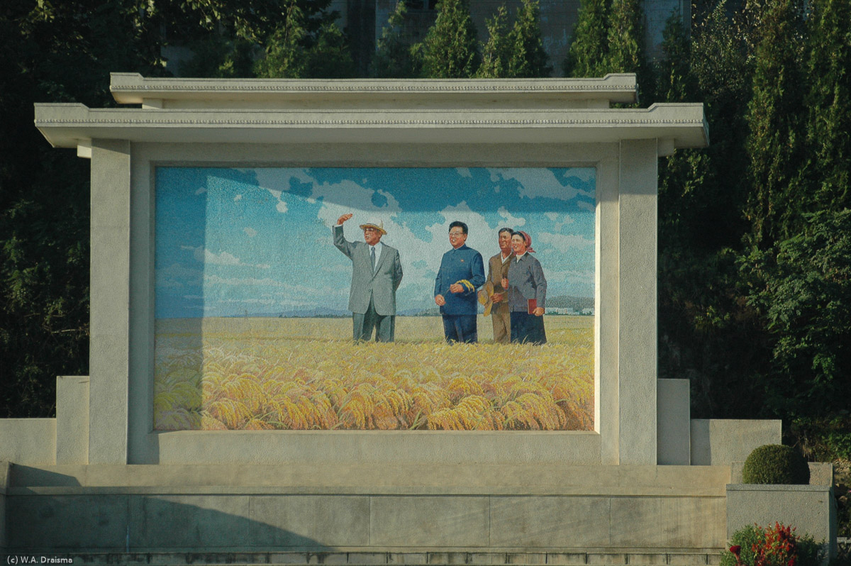 Regularly we notice murals depicting the Great Leader Kim Il Sung and his beloved son Kim Jung Il visiting places like this field of rice.