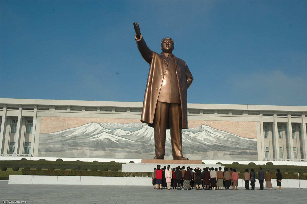 The Grand Monument is one of the most sacred places in North Korea. Its 20m towering bronze statue of Kim Il Sung stands in front of a mosaic depicting North Korea's spiritual source Mt. Paektu.