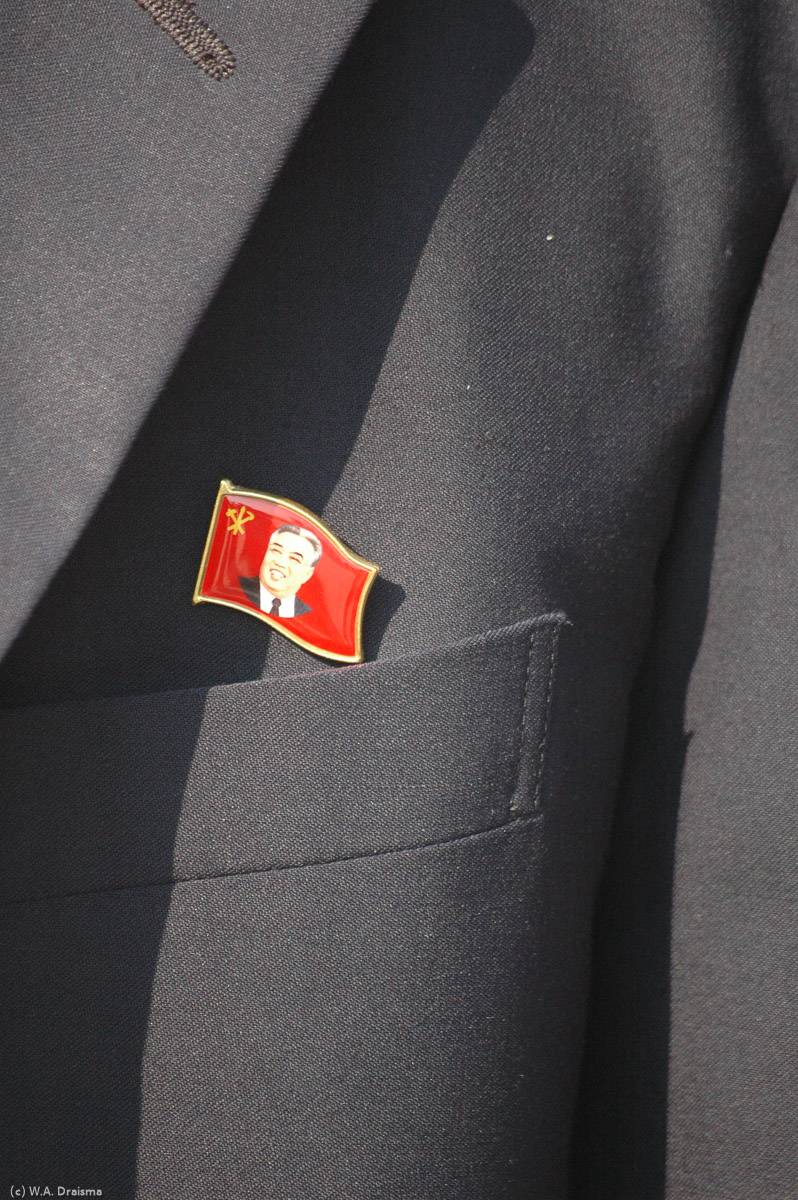 As all people over 14 years our guide carries a pin with the image of the Great Leader close to his heart. It is said that the pin reveals the wearer's social status.