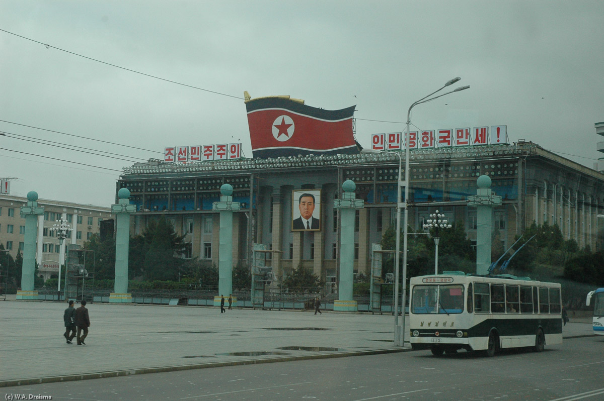 Today is the day of the Arirang Mass Games. But first we go out again, passing the Ministry of Agriculture at Kim Il Sung Square. The characters read "Victory for our Choson Democracy".