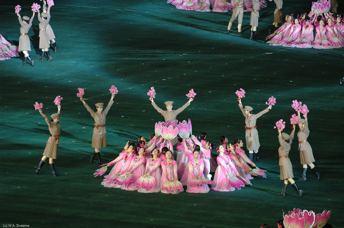 Part of scene 3, the Korean national flower Kimilsungia, created from 24 women each.