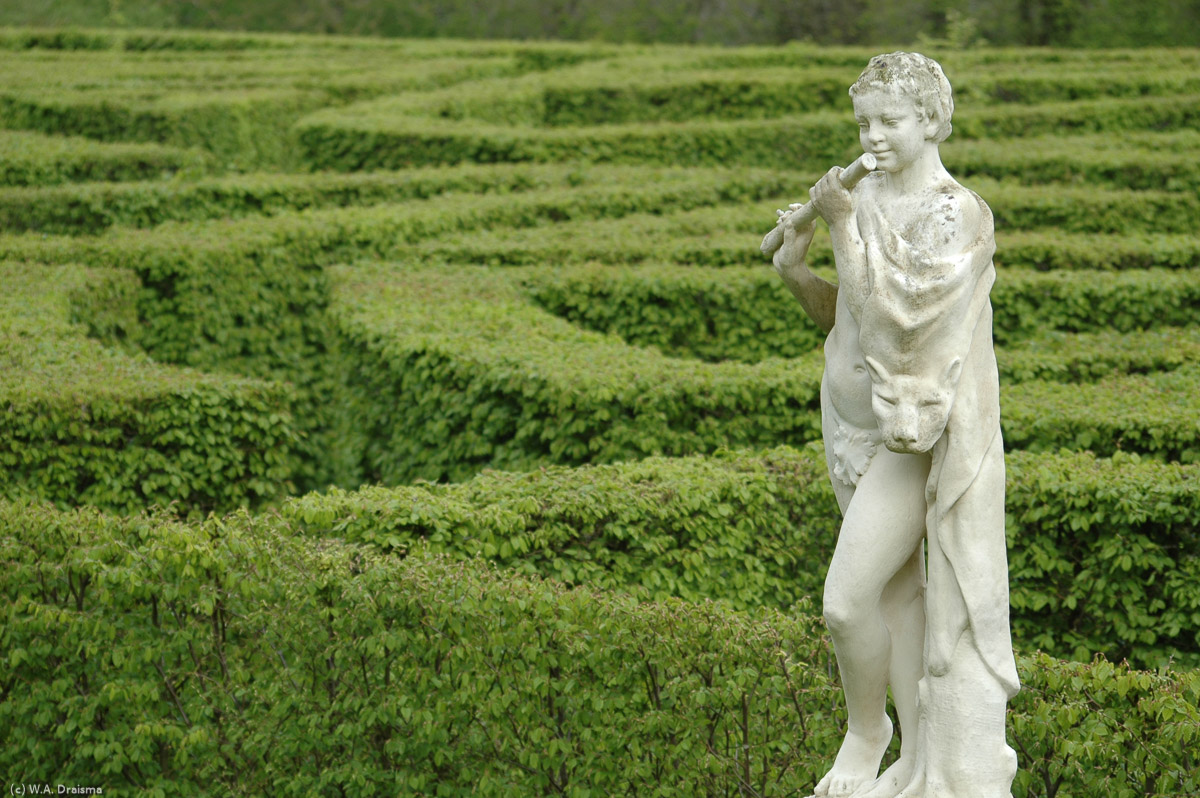 The gardens contain a labyrinth, trees, fountains and many marble statues, like this flute-playing boy.