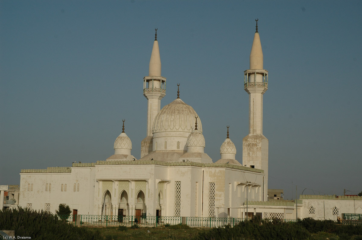 The modern, white Bilal Mosque has an attractive onion-like dome flanked by four smaller domes, as well as two piercing minarets.