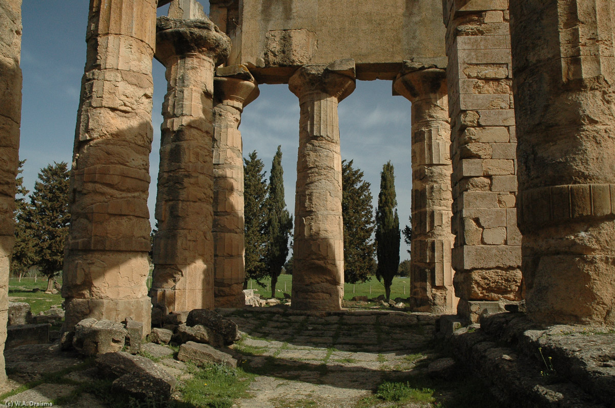 The Temple of Zeus measures 32m by 70m and was surrounded by two rows of eight and two rows of 17 Doric columns. On the main platform was a statue of a seated Zeus holding Victory in his right hand and a sceptre in his left.