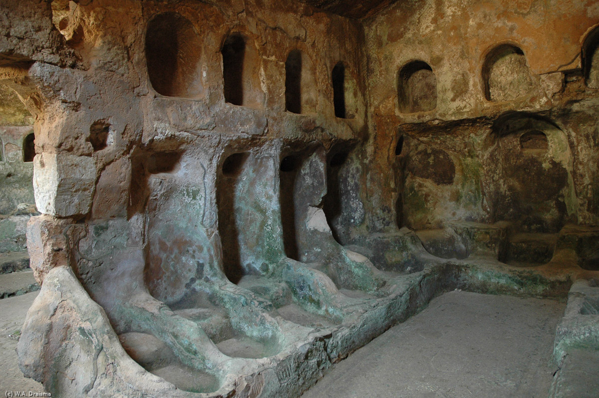 In the cliffs beneath the agora public baths were carved out. Seated and with space to store belongings (or oil lamps) overhead bathers could wash their troubles away.