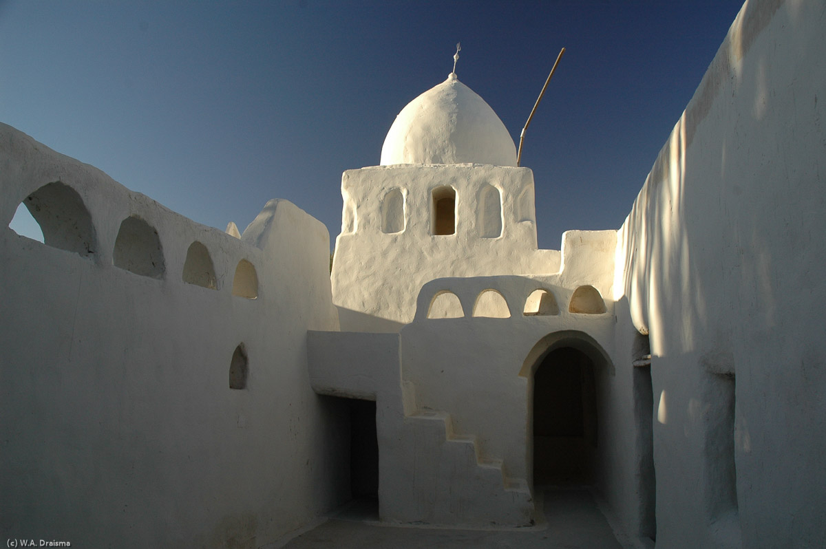 The madrassa was the place for the Quran and islamic law to be taught.