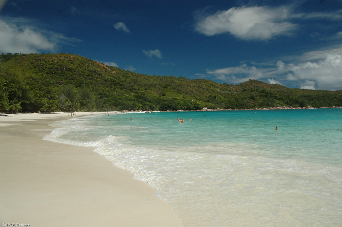 A long white sandy beach, turquoise waters and only a handful of others enjoying the scenery.