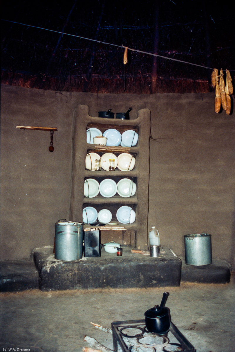 The kitchen huts are the domain of women. The amount of pottery and plates show the owner's wealth. Cooking takes place on the ground and the roof is created in such a way that the smoke easily passes while rain doesn't.