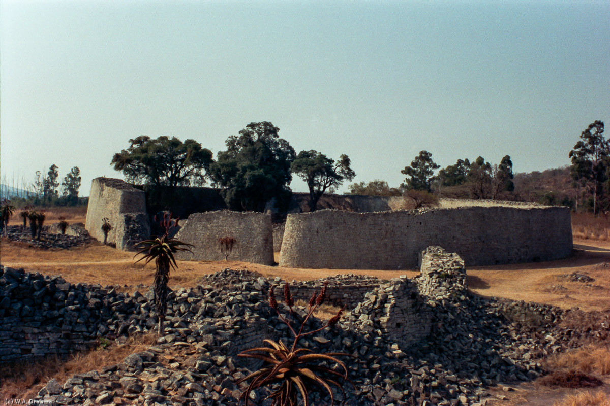 The Great Enclosure, one of three distinct architectural groups in Great Zimbabwe, was occupied from the thirteenth to fifteenth centuries. It has walls as high as 11 m extending approximately 250 m, making it the largest ancient structure south of the Sahara Desert. At the height of its power, this was believed to be the place where the king, his mother and his senior wives lived.