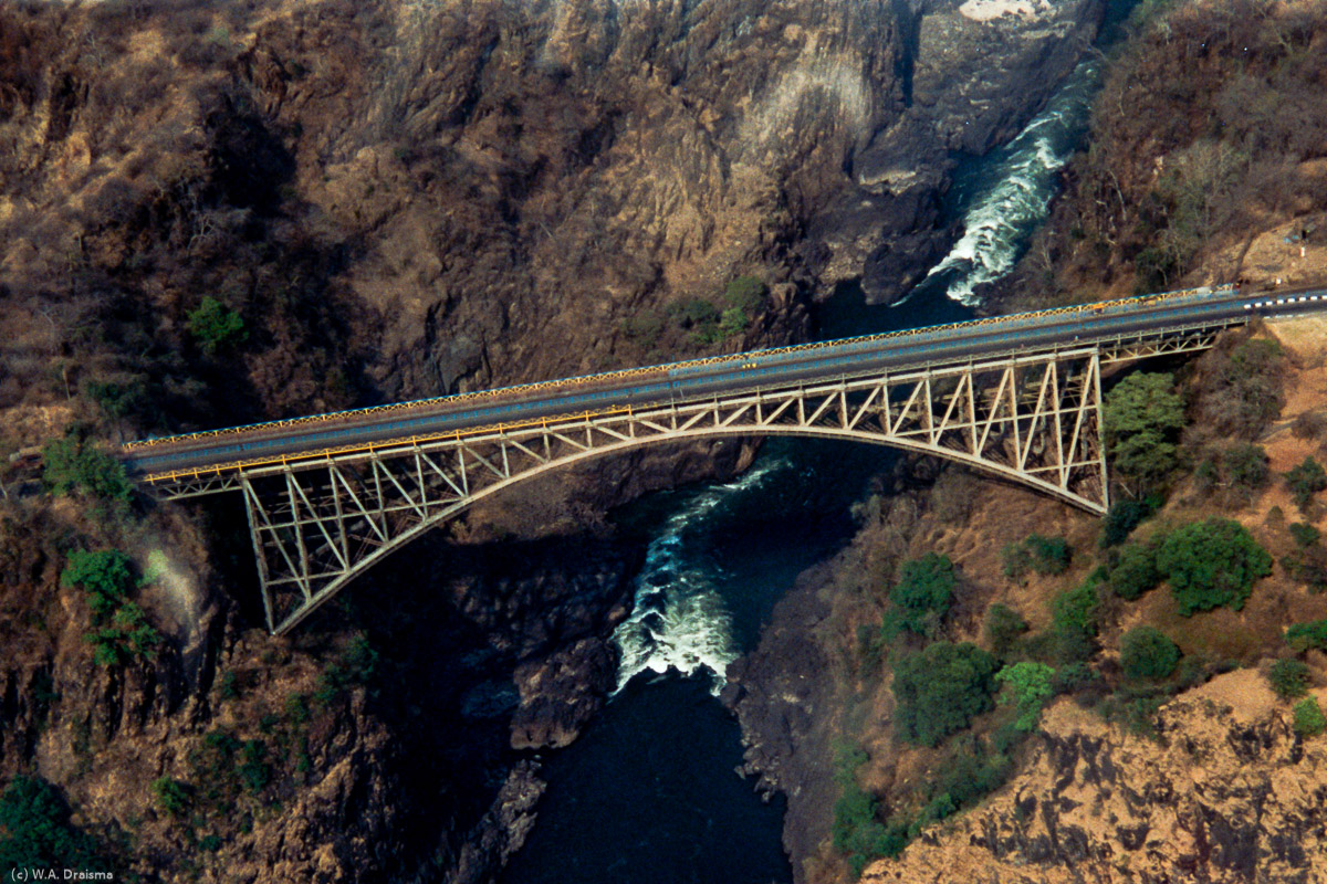 The bridge connecting Zimbabwe and Zambia spans Second Gorge. Initially meant to be part of Cecil Rhodes' Cape to Cairo railway Rhodes is recorded as instructing the engineers to ''build the bridge across the Zambezi where the trains, as they pass, will catch the spray of the Falls''.