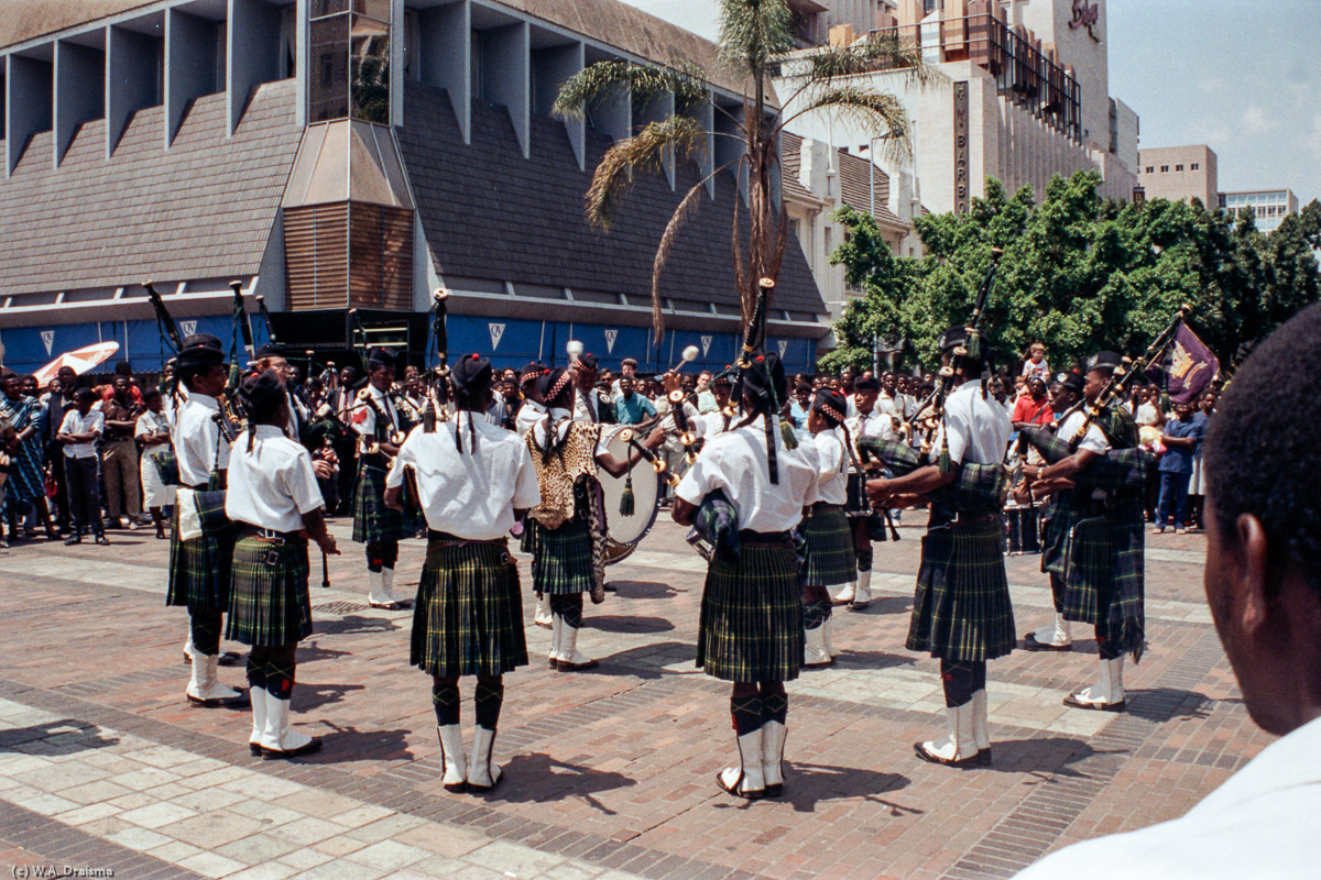 A piper band links Zimbabwe to its colonial times under British rule.